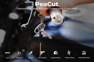 PeaCut titanium keychain box cutter with glow-in-the-dark tritium